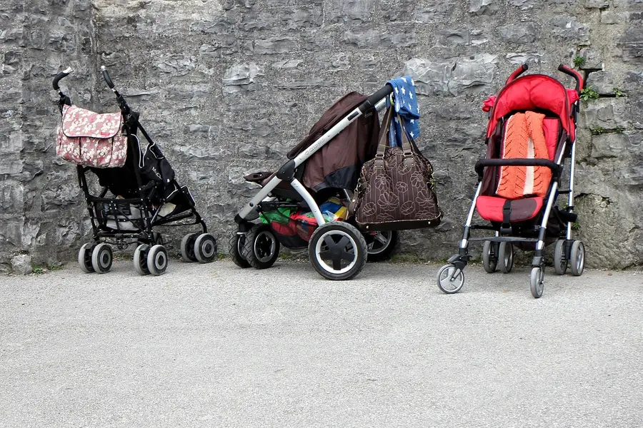 Three different stroller models parked side by side, each fitted with its own gear